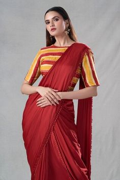 Rust pre-drape saree featuring dangling pipe and bead detailing on the hem. Paired with stripe pattern padded blouse. - Aza Fashions Traditional Blouse With Draped Sleeves For Reception, Traditional Draped Cutdana Blouse Piece, Traditional Draped Blouse Piece With Cutdana, Festive Draped Georgette Blouse, Traditional Georgette Blouse With Draped Sleeves, Traditional Blouse With Draped Sleeves In Georgette, Traditional Fitted Draped Blouse, Traditional Fitted Dupatta With Draped Sleeves, Traditional Saree Blouse Piece With Draped Sleeves