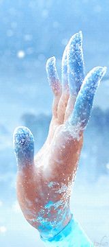 the hand is covered with ice and water as if it were floating in the air