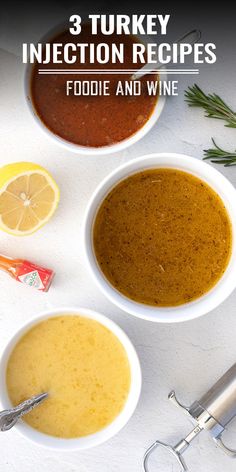 three white bowls filled with soup next to an orange slice and some spices on the side