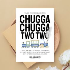 a card with the words chuga chuga two two on it next to flowers