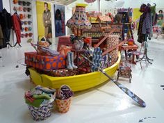 a boat filled with lots of colorful items