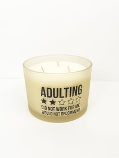 an adulting candle sitting on top of a table