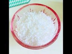 a bowl filled with white rice sitting on top of a table