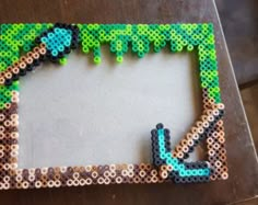 a photo frame made out of perler beads