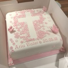 a pink and white cake in a box with the number 11 on it's side