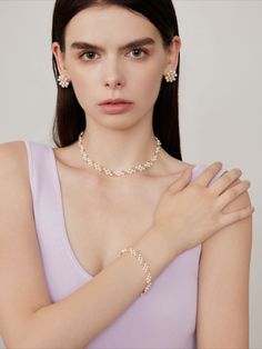 This stunning piece features a seamless fusion of delicate gold beads, creating a mesmerizing interlocking pattern. Crafted with precision and attention to detail, this choker necklace exudes elegance and sophistication, adding a touch of luxury to any ensemble. Elevate your look with this versatile accessory, perfect for both casual and formal occasions. Metal: 14K Gold Filled Gemstone: Freshwater Pearl Length: 350mm(Includes extension chain 50mm) Width: 8mm(including metal parts) Delicate Chain Jewelry For Party, Delicate Party Jewelry With Chain, Gold Plated Choker For Wedding, Gold Pearl Necklace For Evening, Elegant Gold Pearl Necklace For Evening, Yellow Gold Beaded Jewelry For Wedding, Elegant Gold Beaded Necklaces For Evening, Delicate Evening Necklaces, Formal Single Strand Choker