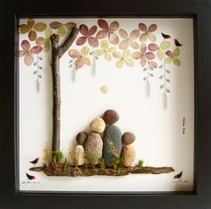 a shadow frame with rocks and leaves on it