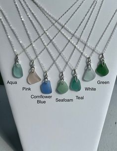 "This listing is for one authentic sea glass necklace in your favorite color. This necklace will be custom made based on your selections. Please allow 2-3 business days for creation prior to shipping.  This classic, elegant necklace features a single piece of irregular sea glass accentuated with a slick sterling silver open bail. Beautiful colors sea glass found on the beaches around the world is truly beautiful!  It comes added on a 1.6 mm sterling silver cable chain in your choice of length. Please choose from the menu at check out to customize your one of a kind necklace.  Please note that the sea glass may Slightly vary in shape and size to the piece listed as each piece is different and unique.  They will NOT be prefect shape of sea glass.  Aprox. dimension will be 3/4\" to 7/8\" for Sea Glass Accessories, Beach Glass Necklace, Sea Jewelry, Gift For Mothers Day, Sea Glass Earrings, Sea Glass Pendant, Jewelry Simple, Elegant Necklace, Sea Glass Necklace