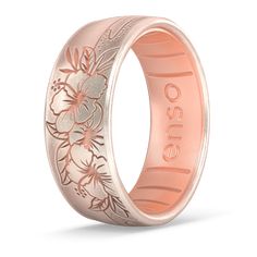 an engraved wedding ring with flowers on the inside and in pink gold, against a white background