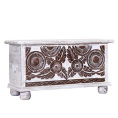 an ornate wooden box with wheels on the bottom and floral designs painted on it's sides