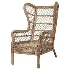 a wicker chair with white cushions on it's back and armrests