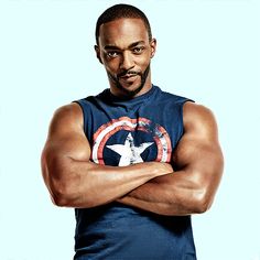 a man with his arms crossed wearing a tank top that says captain america on it