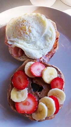 a breakfast sandwich with fruit and an egg on top