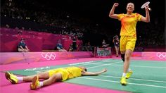 two women in yellow uniforms on a tennis court