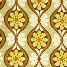 an old fashioned wallpaper with yellow and brown flowers on the side, as well as circles