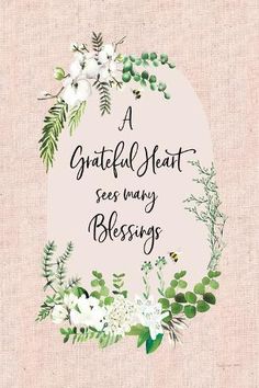 a quote with white flowers and greenery around it that says, a grateful heart sees many blessings