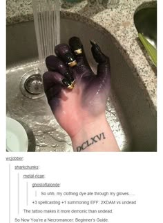 someone has their hand in the sink with purple paint on it, and is holding something up