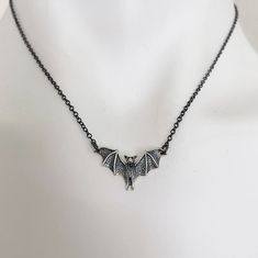 Detailed Bat Necklace.   Sterling Silver Charm 1" x 1/2" on delicate oxidized black sterling silver chain. Chain is 16" + 1.5" extender chain to adjust to your desired length with lobster claw.  Message us if you need a longer chain. Necklace is packaged on an Alexander & Quayle jewelry card inside a 3.5" x 3.5" white jewelry box. Free polishing cloth and sticker included. Makes a perfect gift! Black Halloween Jewelry With Adjustable Chain, Black Gothic Jewelry With Oxidized Finish, Black Sterling Silver Necklace For Halloween, Adjustable Hypoallergenic Black Necklace, Gothic Halloween Jewelry With Oxidized Finish, Halloween Gothic Jewelry With Oxidized Finish, Gothic Oxidized Jewelry For Halloween, Black Sterling Silver Necklace With Oxidized Finish, Sterling Silver Necklace With Oxidized Black Finish