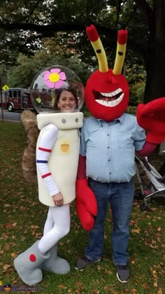 a man and woman in costume standing next to each other