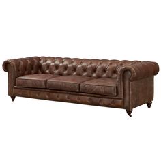 a brown leather couch sitting on top of a white floor