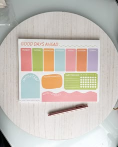 a notepad with the words good days ahead written on it and a pen next to it