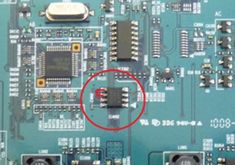 an electronic board with some wires and connectors attached to the motherboard is circled by a red circle