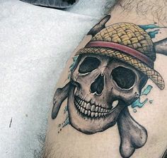 a man with a skull and crossbones tattoo on his arm is wearing a pirate hat