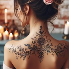 a woman with a rose tattoo on her back