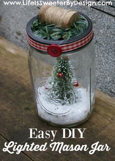 a mason jar with a christmas tree in it