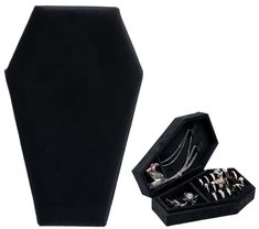 an open black velvet box with jewelry inside