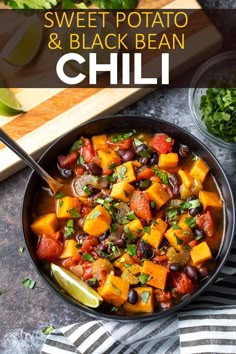 sweet potato and black bean chili in a skillet with limes on the side