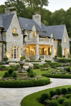 a large house with lots of windows and landscaping