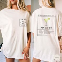 Embrace our Margarita Cocktail Club shirt! This tee is perfect for anyone who loves cocktails or appreciates aesthetic shirts! Treat yourself or surprise a friend with this thoughtful gift!  👕 COMFORT COLORS 1717 T-SHIRT The Comfort Colors 1717 garment-dyed unisex t-shirt is made with medium fabric consisting of high quality, 100% ring-spun US cotton for long-lasting comfort. All shirts feature pre-shrunk cotton for size retention and a signature sewn-in twill label. 👕 SIZING & CARE Shirt runs Margarita Shirt, Cocktail Club, Margarita Cocktail, Aesthetic Shirts, Club Shirts, Signature Cocktail, Happy Hour, Girls Night Out, Girls Night