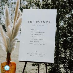 an unplugged ceremony sign next to a vase with pamodia in it