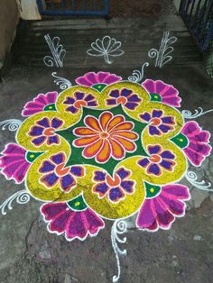 a colorful flower design on the ground