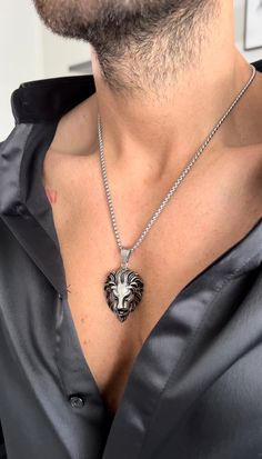 Our silver colored lion head necklace is the perfect statement piece in our men's collection with this large lion pendant. Symbol of a fierce, bold and strong man. Perfect gift idea. Material: Stainless Steel. Tarnish resistant and waterproof. Size: 20 inch. ﻿ALL SALE ITEMS ARE FINAL SALE Lion Necklace Mens, Lion Head Necklace, Largest Lion, Strong Man, Lion Necklace, Lion Pendant, Head Necklace, Silver Lockets, Men Style Tips