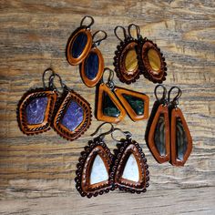 Hand picked matching stones inlayed in English tanned leather with a wax finish - stainless steel hooks and bails -English (rust color) tanned -Wax finish coat -Double leather totaling 6oz thickness $Find more of my rustic hand made designs https://www.etsy.com/shop/KCsDesignsShop #Message for coupons and sale codes if you can't find them on-site. Elegant Brown Leather Jewelry, Rustic Brown Hand Forged Jewelry, Rustic Hand Forged Brown Jewelry, Bohemian Hand-tooled Leather Earrings, Artisan Brown Earrings With Natural Stones, Brown Adjustable Drop Earrings, Adjustable Brown Drop Earrings, Hand Tooled Adjustable Jewelry For Everyday, Unique Brown Drop Earrings