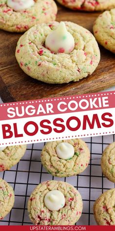 sugar cookie blossoms on a cooling rack with white frosting and sprinkles