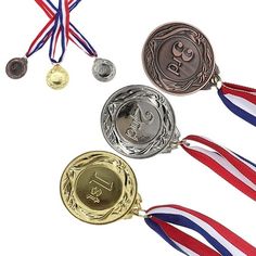 three medals with ribbons around them on a white background