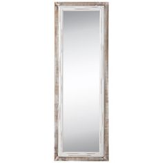 a tall mirror sitting on top of a white wall