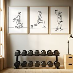 three black and white drawings hang on the wall above a gym equipment rack with dumbbells