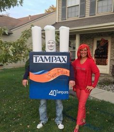 two people are standing in front of a sign that says tampa with an image of a woman's face on it