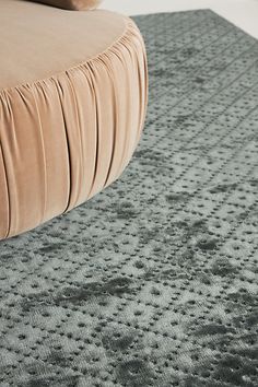 a close up of a couch on a carpet