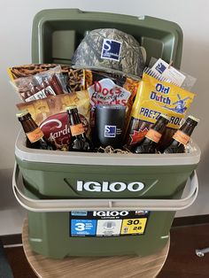 a cooler filled with food and snacks on top of a table