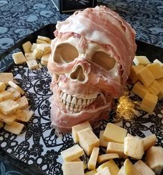 there is a skull made out of cheese on the plate