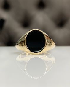 Welcome to Mastika Jewelry! If you would like to get timeless pieces with high quality, you are in the best place.. This stylish flat cut UNISEX onyx signet ring can be the best gift for yourself or for the loved ones; for men or women.  And can be an elegant choice for special days. Just wear it and feel the high-quality craftsmanship!   And here is the all details : ◎ Ring Details ◎ ○ Gemstone Details .Natural ONYX Cut : Special Oval Cut Size / Weight : approx. 11.40x9.50 mm , approx 0.70 ct Quality: eye-clean/ flawless ○ Gold Details 8K Solid Gold  (White or Yellow) or  14K Solid Gold (White, Yellow or Rose) or  925 Sterling Silver (Just silver or Yellow Gold (YG), White Gold (WG), Rose Gold(RG) Plated) Weight of Ring : approx 6.00 gr Width of Band : approx from 2.50 to 8.90 mm Thicknes Formal Gold Signet Ring With Onyx, 14k Gold Black Signet Ring With Polished Finish, Elegant Onyx Signet Ring With Gemstone, Formal Gold Onyx Signet Ring, Modern Onyx Signet Ring With Polished Finish, Pinky Signet Ring, Onyx Signet Ring, Family Jewelry, Family Jewellery