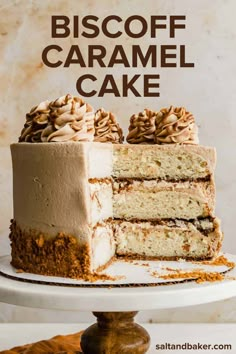 a close up of a cake on a plate with the words biscoff caramel cake