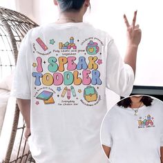 the back of a woman's white shirt that says speak toober