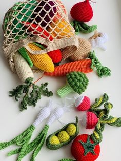 crocheted vegetables are laying on the table