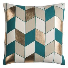 a blue and white pillow with gold foiling on it's sides, in the shape of a chevroned pattern